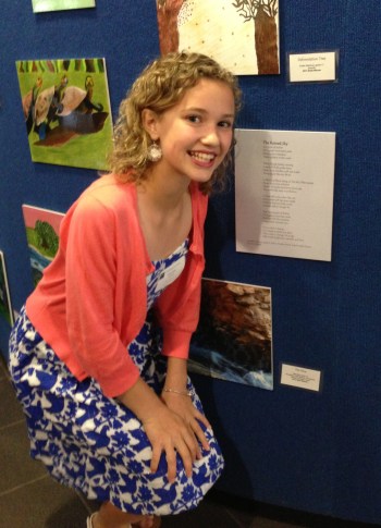 Caroline Coleman stands with her poem at the Georgia River of Words Awards Ceremony in Decatur, Georgia. 